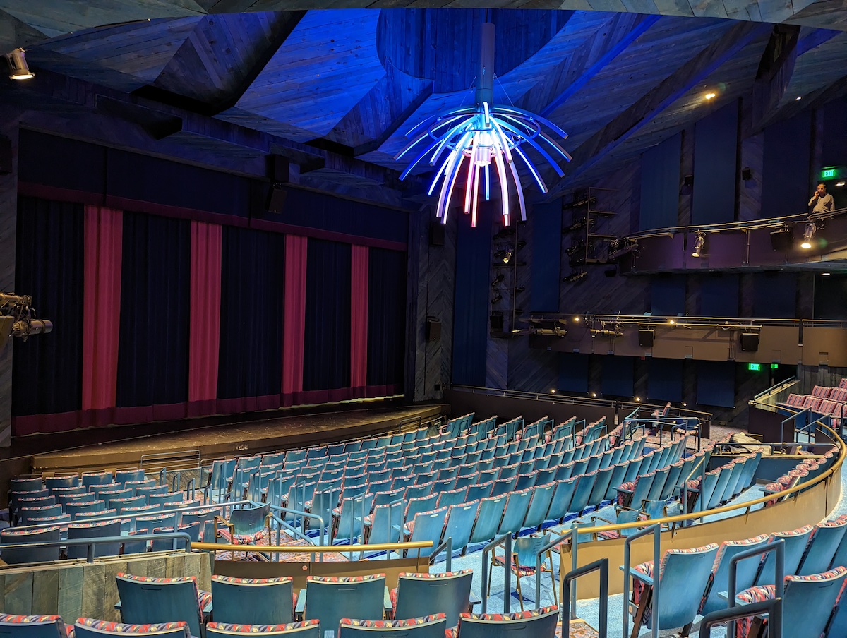 Multicolored chandelier inside a performance space