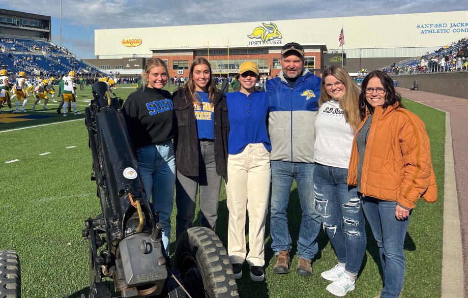 Natvig family assembles on the field of Dana J. Dykhouse Stadium