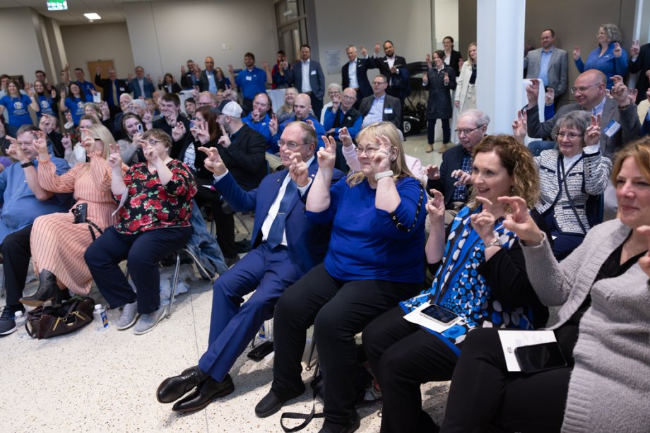 Dick and Karen McComish and others gathered at the naming ceremony for the McComish Department of Electrical Engineering and Computer Science offered their ears up in celebration.