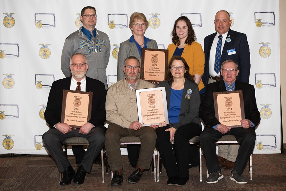 Distinguished Service Award recipients, shown with their plaques, from SDSU were honored at the 96th annual South Dakota State FFA Convention on April 19 in Brookings.