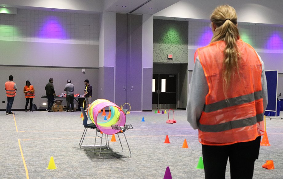 A student attempts to fly a drone through an obstacle during “Drone Day” at South Dakota State University.