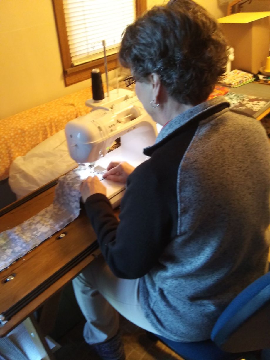 Sue Fierstine works on a project in her Brookings sewing room. The SDSU employee uses her hobby to help the Delivering Hope cancer support group.