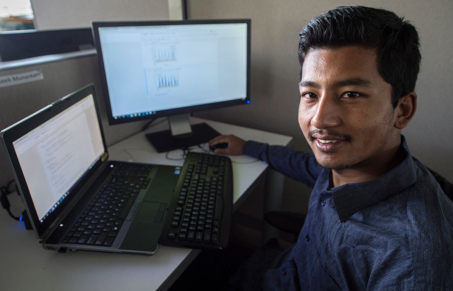 Prateek Munankarmi working on a computer.