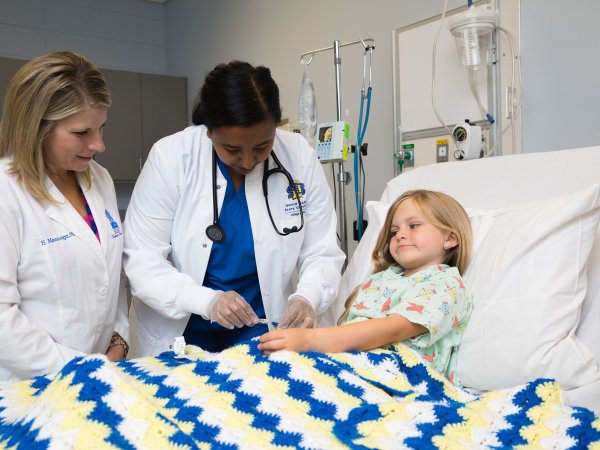 Nursing student working with a patient.