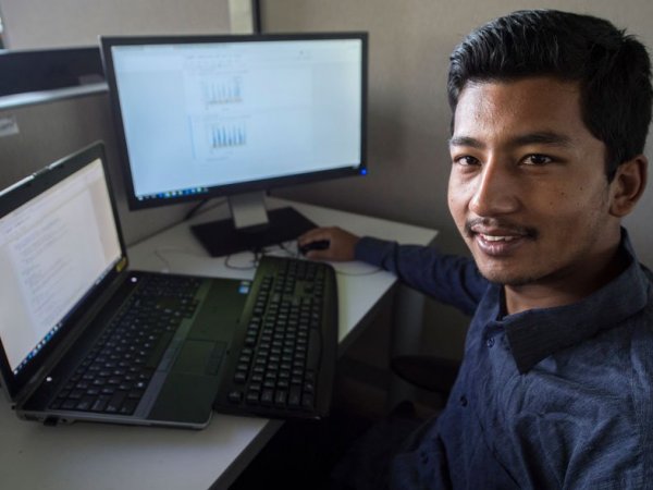 Prateek Munankarmi works on a computer.