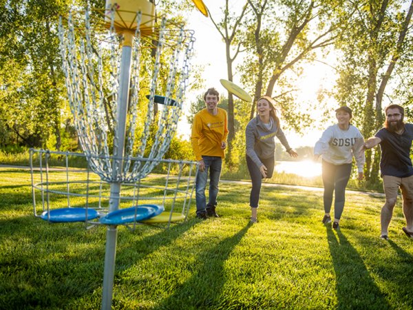 SDSU Students playing frisbee golf 