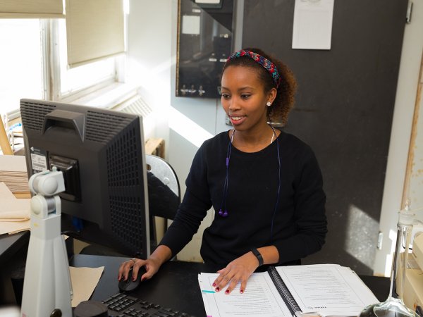 A student working on a computer.