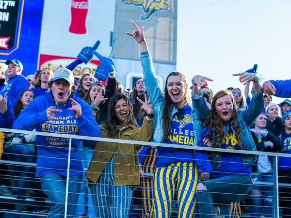 Students cheering at SDSU football game