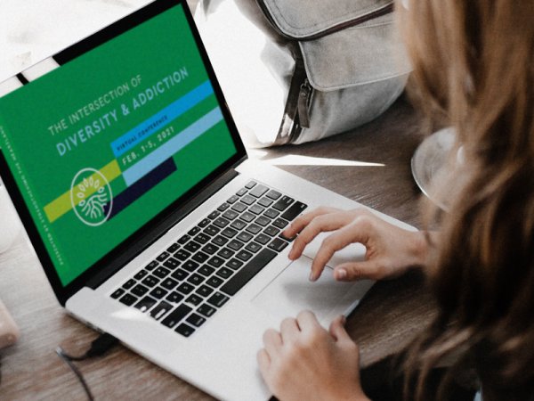 Woman on Laptop Registering for Conference