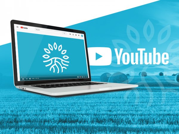 Computer on a graphic blue background with YouTube Logo