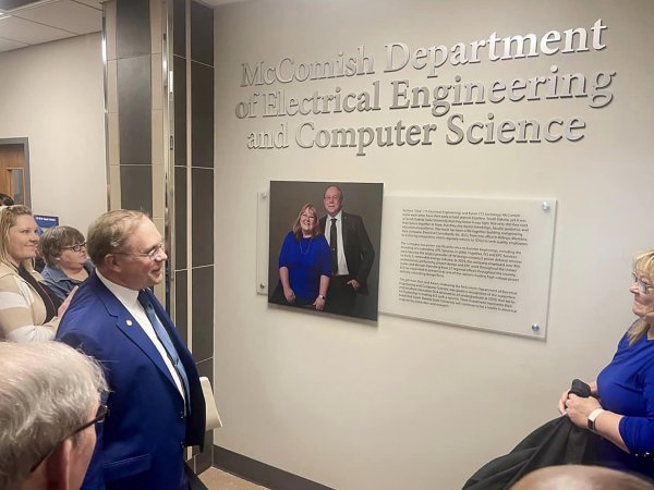 Dick and Karen McComish look on after unveiling the signage naming the new McComish Department of Electrical Engineering and Computer Science.