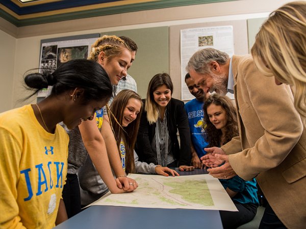 Students gather around Darrell Napton, a professor in the Department of Geography and Geospatial Sciences.