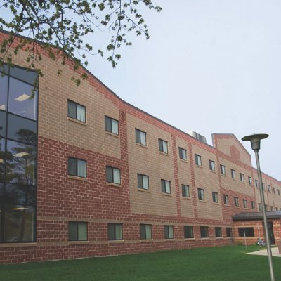 Caldwell Hall on a green grass lawn