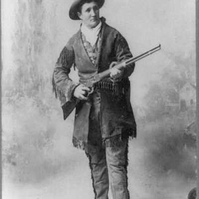 Calamity Jane holding a gun