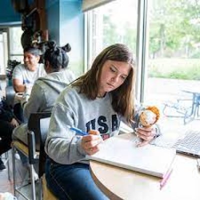 Student eating ice cream while studying