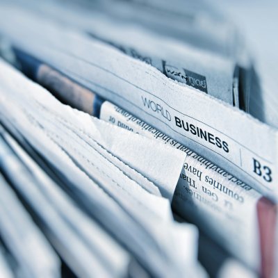 An image showing top part of a stack of newspaper.