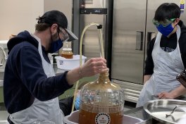 Students working in a brewing lab.