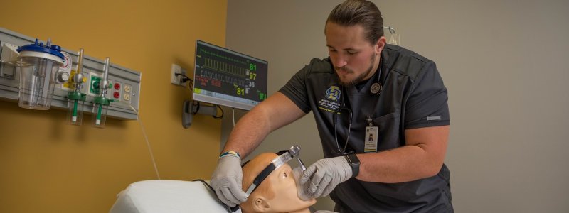 Respiratory care student and mannequin