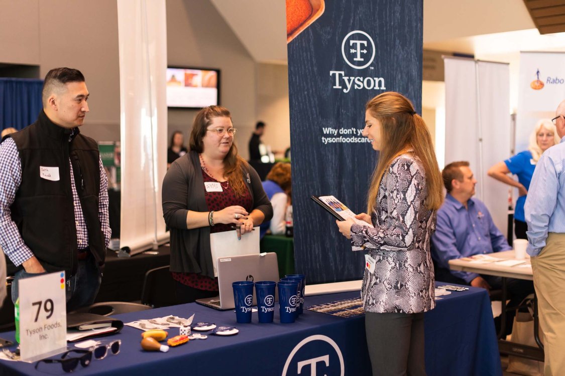 CAFES student talking to Tyson representative 