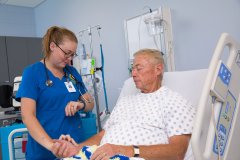 Nursing student working with a patient.