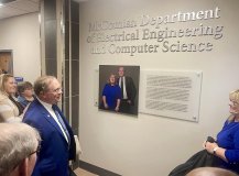 Dick and Karen McComish look on after unveiling the signage naming the new McComish Department of Electrical Engineering and Computer Science.