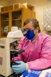 Student using microscope