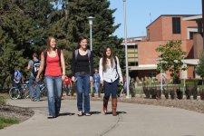 Students walking on sidewalk by union