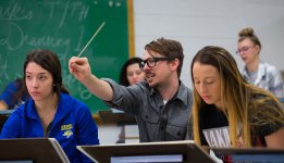 A professor works with two students