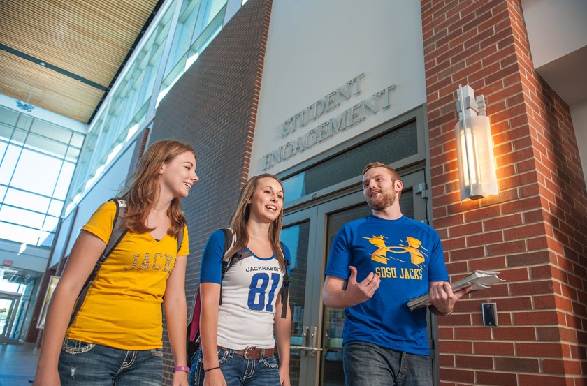 Students walking in front of Student Engagement Office