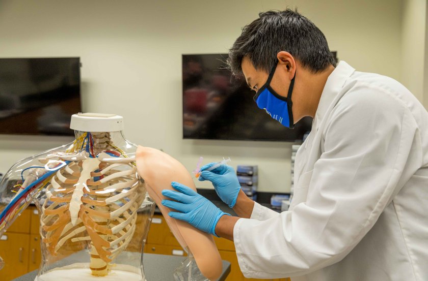 Student administers a vaccine