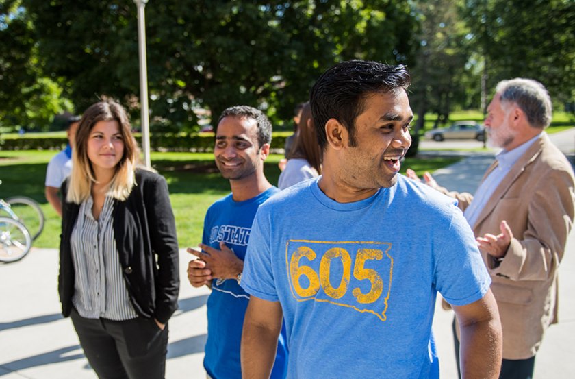 various students talk outside