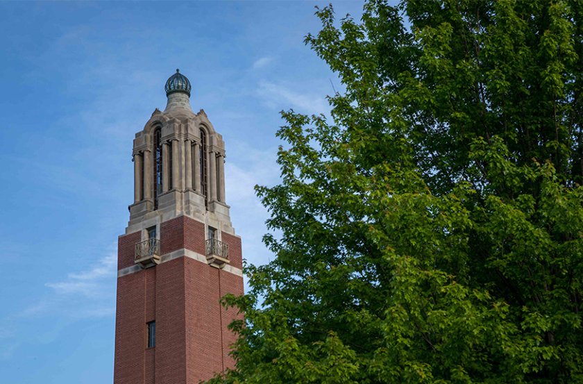 image of campanile with tree on the right of the photo