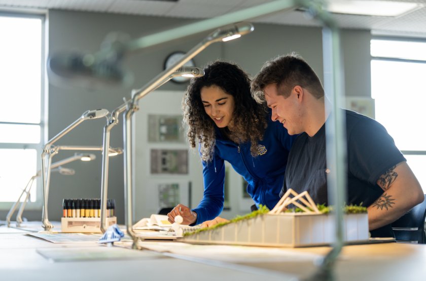 Two students working on a landscape project