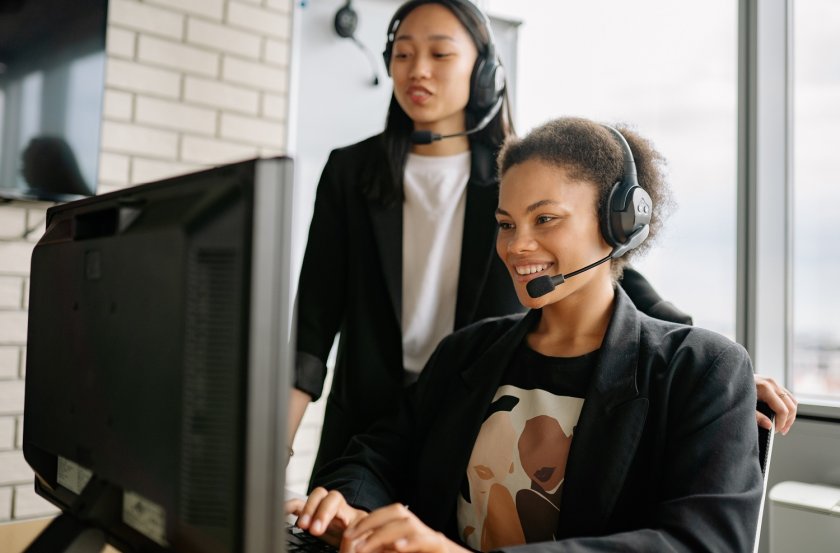 Two Women With Headsets Working As Call Center Agents